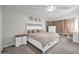 Cozy bedroom with neutral tones, natural lighting, and a comfortable king-sized bed at 13625 W Peck Ct, Litchfield Park, AZ 85340