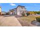 Charming two-story home featuring a well-manicured lawn, stone accents, and a spacious driveway at 13625 W Peck Ct, Litchfield Park, AZ 85340
