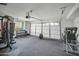 This garage boasts ample space and a rubber mat floor, offering a versatile area for storage and workouts at 13625 W Peck Ct, Litchfield Park, AZ 85340