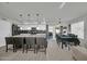 Open kitchen with granite countertops, large island, and dining area, ideal for Gathering gatherings at 13625 W Peck Ct, Litchfield Park, AZ 85340