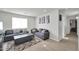 Cozy living room with comfortable seating, stylish decor, and abundant natural light at 13625 W Peck Ct, Litchfield Park, AZ 85340