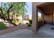 Charming back patio is a serene space with mature trees and comfortable seating at 13805 N Hamilton Dr # H102, Fountain Hills, AZ 85268