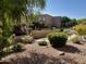 Beautiful community pool area with desert landscaping and mature trees near the building at 13805 N Hamilton Dr # H102, Fountain Hills, AZ 85268