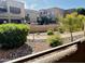 View of community pool with desert landscaping from balcony at 13805 N Hamilton Dr # H102, Fountain Hills, AZ 85268