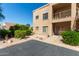 Condo exterior with desert landscaping, beige stucco and patio at 13805 N Hamilton Dr # H102, Fountain Hills, AZ 85268