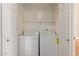 Laundry closet featuring a dryer and washing machine with shelving for storage at 13805 N Hamilton Dr # H102, Fountain Hills, AZ 85268