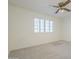 Bedroom with a ceiling fan and a window featuring wooden shutters at 14110 W White Rock Dr, Sun City West, AZ 85375