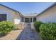 View of the brick-paved walkway leading to the front gate and home entrance at 14110 W White Rock Dr, Sun City West, AZ 85375
