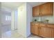Hallway featuring built-in cabinets and views into the living space at 14110 W White Rock Dr, Sun City West, AZ 85375