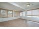 Relaxing sun room with tile floors and bright natural light at 14110 W White Rock Dr, Sun City West, AZ 85375