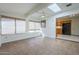 Inviting sun room with skylight, neutral tile, and lots of natural light at 14110 W White Rock Dr, Sun City West, AZ 85375