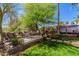 Relaxing backyard with comfortable seating, a dining area, and a colorful mural for added charm at 1421 W Saltsage Dr, Phoenix, AZ 85045