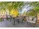 Serene backyard patio offers cozy seating arrangements with a decorative egg chair at 1421 W Saltsage Dr, Phoenix, AZ 85045