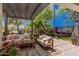 Cozy backyard patio with stylish outdoor furniture and a lush green landscape at 1421 W Saltsage Dr, Phoenix, AZ 85045