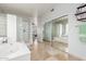 Modern bathroom featuring a glass-block shower and tub area, offering both style and functionality at 1421 W Saltsage Dr, Phoenix, AZ 85045