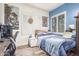 Comfortable bedroom with a corner view, desk, computer and a unique poster collection at 1421 W Saltsage Dr, Phoenix, AZ 85045