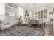 Elegant dining room featuring a modern chandelier and stylish decor, perfect for gatherings at 1421 W Saltsage Dr, Phoenix, AZ 85045