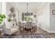 Bright dining room with a round table, chandelier, and large window with natural light at 1421 W Saltsage Dr, Phoenix, AZ 85045
