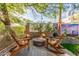 Inviting outdoor space with Adirondack chairs surrounding a modern fire pit at 1421 W Saltsage Dr, Phoenix, AZ 85045