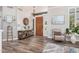 Stylish foyer showcasing hardwood floors, a decorative chandelier, and a charming entryway table at 1421 W Saltsage Dr, Phoenix, AZ 85045