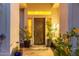 Inviting front entrance featuring a beautifully crafted door and vibrant potted plants, enhancing curb appeal at 1421 W Saltsage Dr, Phoenix, AZ 85045