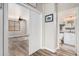 Hallway views shows access to bathroom and bedroom with wood-look floors and light-colored walls at 1421 W Saltsage Dr, Phoenix, AZ 85045