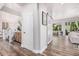 Hallway with neutral walls and wood-look floors has access to a variety of rooms at 1421 W Saltsage Dr, Phoenix, AZ 85045