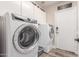 Well-equipped laundry room features modern washer and dryer at 1421 W Saltsage Dr, Phoenix, AZ 85045