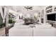 Spacious living room with fireplace, modern ceiling fan, and decoratively adorned built-ins at 1421 W Saltsage Dr, Phoenix, AZ 85045