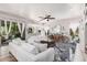 Bright living room features a large white sofa, unique decor and gleaming tile floors at 1421 W Saltsage Dr, Phoenix, AZ 85045