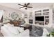 Bright, open living room has a fireplace, built-ins, dark accent floors and lots of natural light at 1421 W Saltsage Dr, Phoenix, AZ 85045