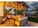 Charming patio space adorned with comfortable seating and string lights, creating a cozy outdoor retreat at 1421 W Saltsage Dr, Phoenix, AZ 85045