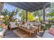 Inviting outdoor living space with comfortable seating under a pergola, perfect for entertaining at 1421 W Saltsage Dr, Phoenix, AZ 85045