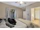 Bright bedroom with a bed, neutral walls and door to the outside patio at 15050 N Thompson Peak Pkwy # 2072, Scottsdale, AZ 85260