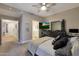 Comfortable bedroom featuring a bed, TV, and dresser with storage at 15050 N Thompson Peak Pkwy # 2072, Scottsdale, AZ 85260