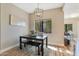 Bright dining area with a modern chandelier, wood floors and large window with tree view at 15050 N Thompson Peak Pkwy # 2072, Scottsdale, AZ 85260