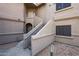 Exterior of a condo building with staircases leading to upper units and well-maintained landscaping at 15050 N Thompson Peak Pkwy # 2072, Scottsdale, AZ 85260