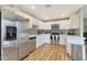 A modern kitchen featuring stainless steel appliances, white cabinets, and light countertops at 15050 N Thompson Peak Pkwy # 2072, Scottsdale, AZ 85260