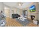 Inviting living room with fireplace, vaulted ceiling, and sliding glass doors at 15050 N Thompson Peak Pkwy # 2072, Scottsdale, AZ 85260
