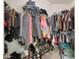 Organized walk-in closet with clothing racks, shelves for shoe storage, and upper storage for neatly folded items at 15050 N Thompson Peak Pkwy # 2072, Scottsdale, AZ 85260