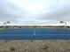 Community basketball court with blue surface and white lines, ideal for sports and recreation at 15781 W Beryl Ave, Waddell, AZ 85355