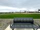 Bench in a community park with green lawns, picnic shelters, and landscaping at 15781 W Beryl Ave, Waddell, AZ 85355