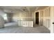Open-concept living room with drywall, a breakfast bar, and an open layout for entertaining at 15781 W Beryl Ave, Waddell, AZ 85355