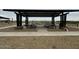 Sheltered picnic area with multiple tables, surrounded by gravel and landscaping at 15781 W Beryl Ave, Waddell, AZ 85355