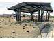 Covered picnic area in a community park with tables, landscaping, and views of the surrounding homes at 15781 W Beryl Ave, Waddell, AZ 85355