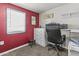 Small office area with a desk, rolling chair, and ample natural light at 1707 S 72Nd St, Mesa, AZ 85209