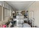 Cluttered covered patio with a large grill and household items at 1707 S 72Nd St, Mesa, AZ 85209