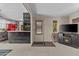 Cozy living room featuring a decorative fireplace and adjoining kitchen at 1707 S 72Nd St, Mesa, AZ 85209
