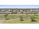Aerial view showcasing the community homes bordering the well-maintained golf course at 1707 S 72Nd St, Mesa, AZ 85209