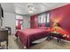 Brightly colored bedroom with neutral carpeting, a ceiling fan and plenty of natural light at 1707 S 72Nd St, Mesa, AZ 85209